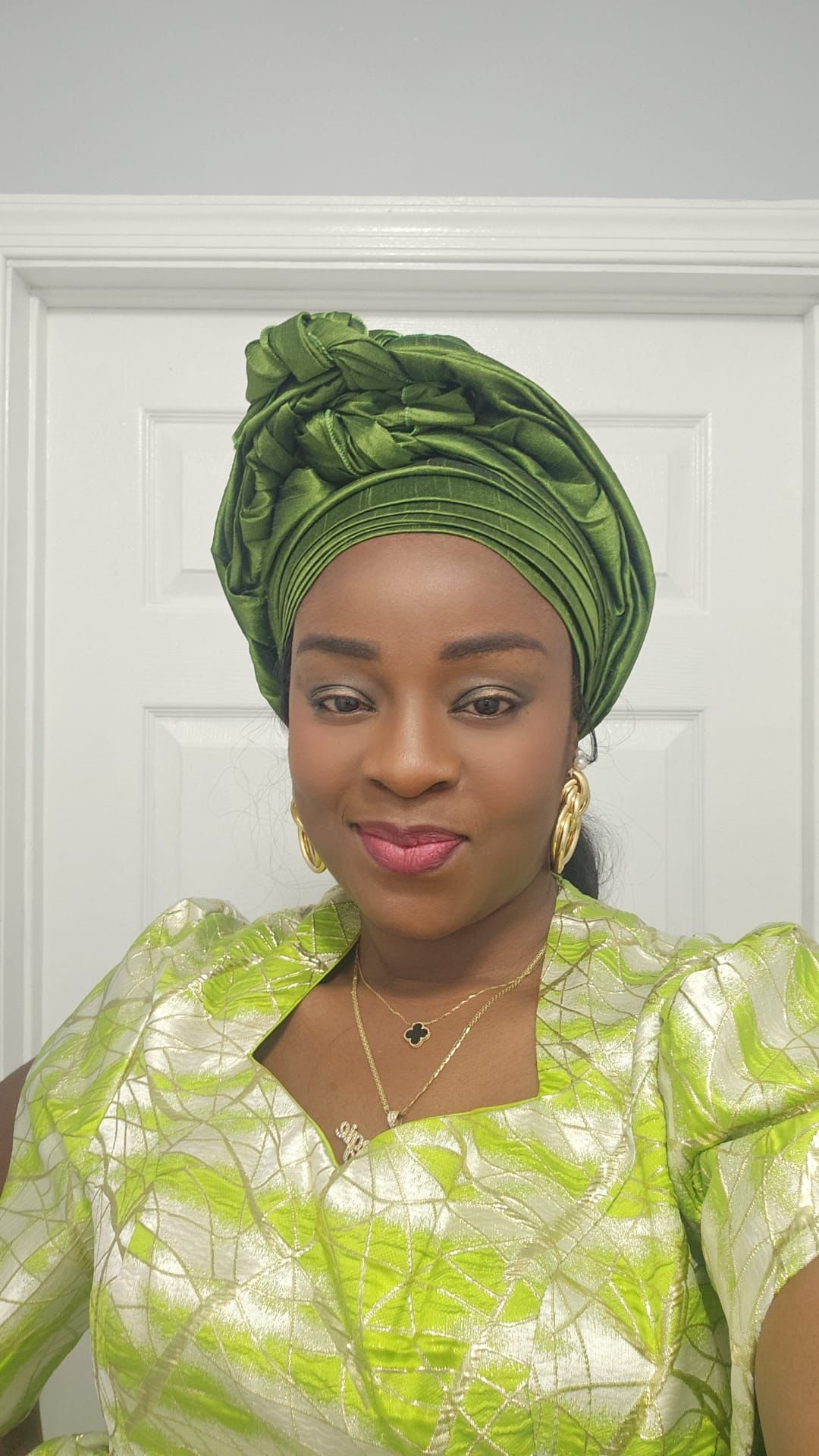 PeridotChozy client in green traditional attire